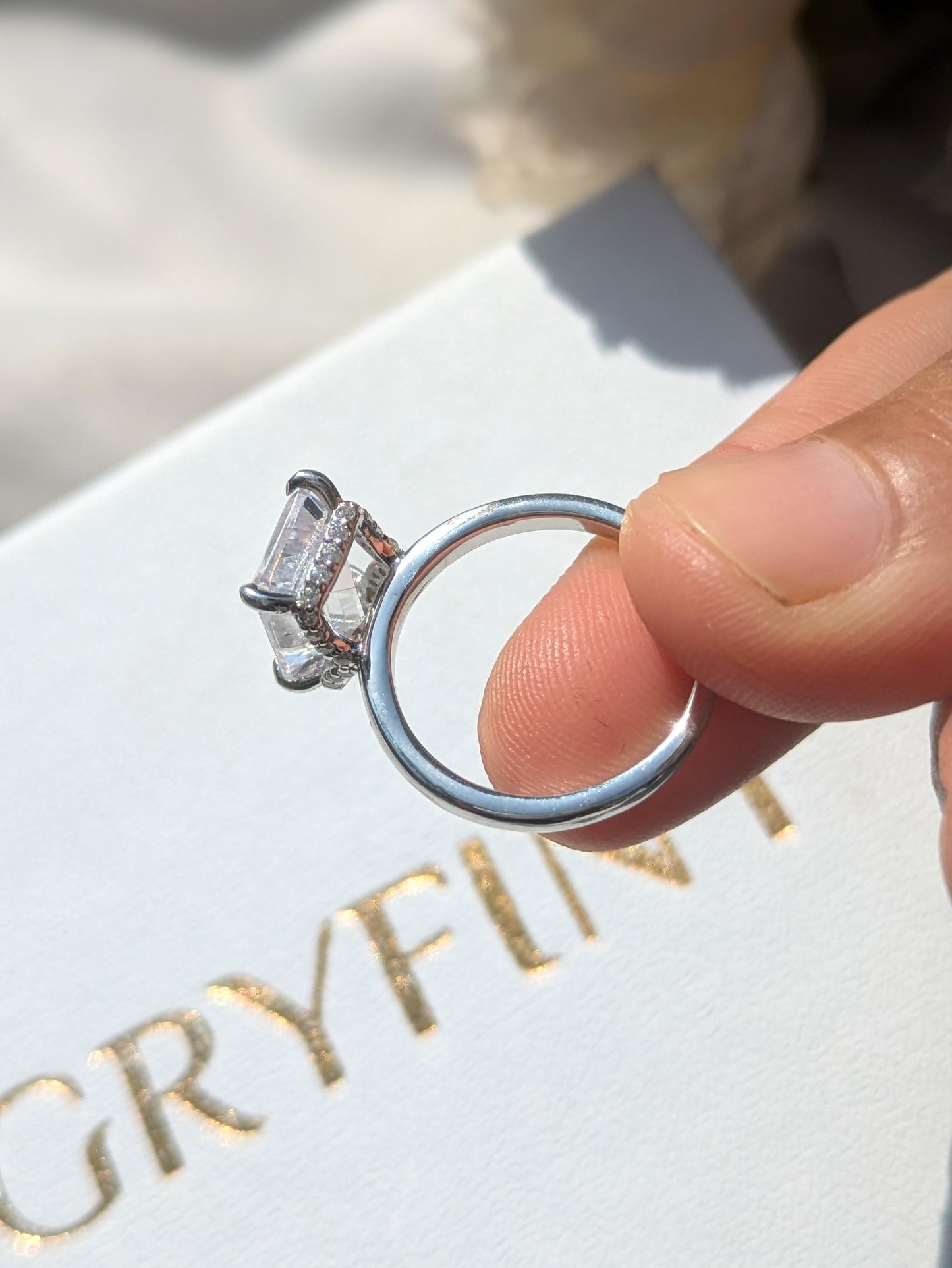 Ariana Emerald Hidden Halo Solitaire Silver Ring